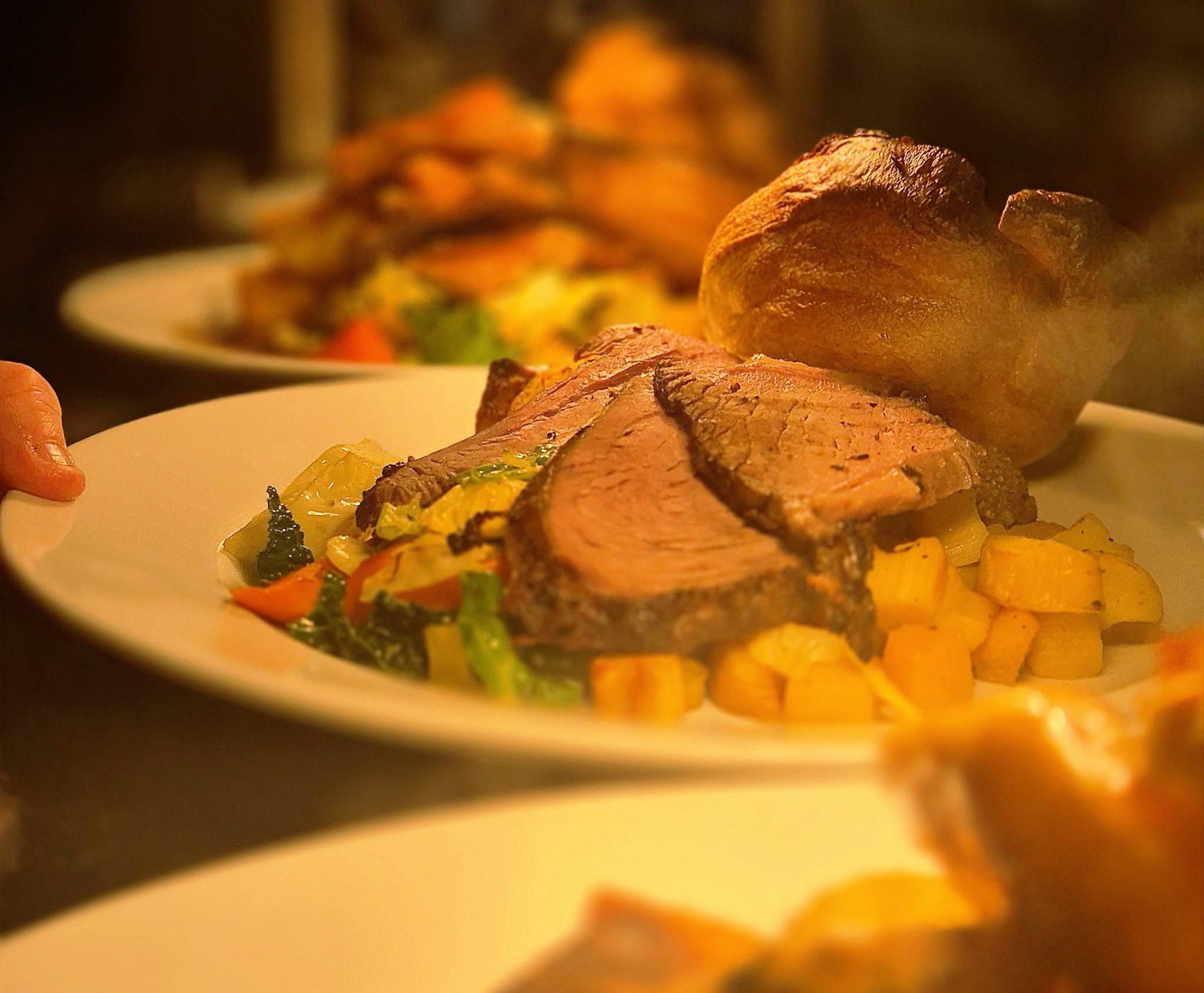 Sunday dinners plated up on the pass at The Wellington Inn kitchen